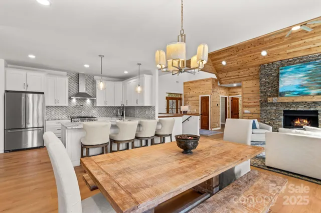 a large kitchen with a table and chairs