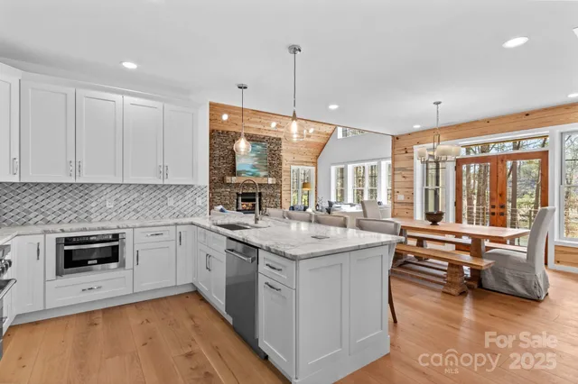 a kitchen with stainless steel appliances granite countertop a stove and a sink