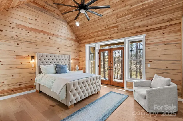 a bedroom with a bed and a couch