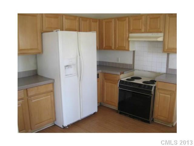 1756 Martin Road Kings Mountain, NC 28086 - Photo 12 of 12 a kitchen with a refrigerator and a stove