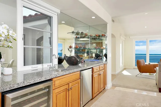 a kitchen with granite countertop a sink and cabinets