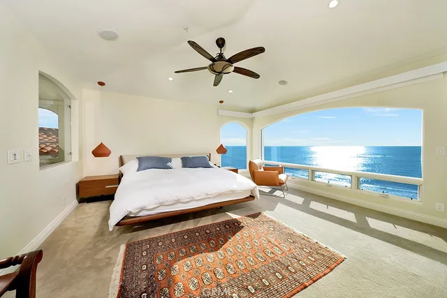 a bedroom with bed and window