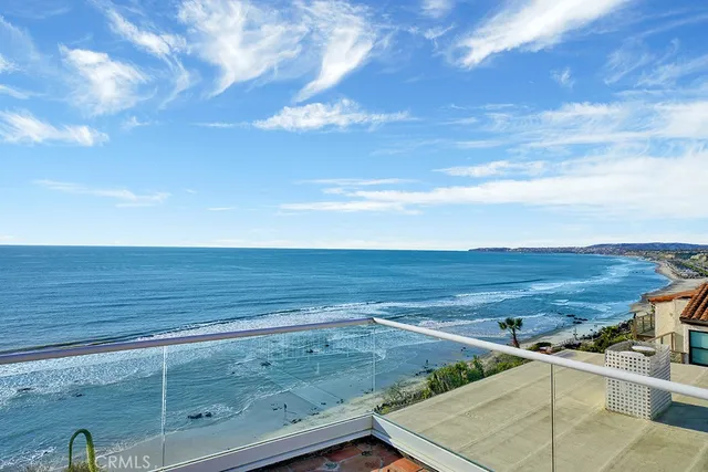 a view of a terrace with wooden floor and fence