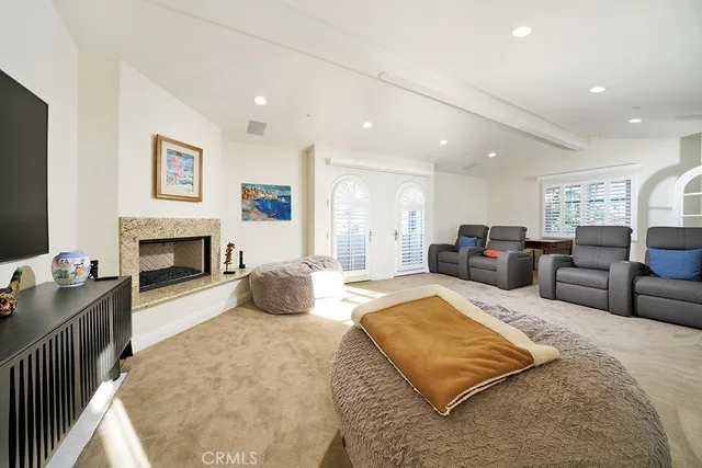 an aerial view of residential building with parking and city view