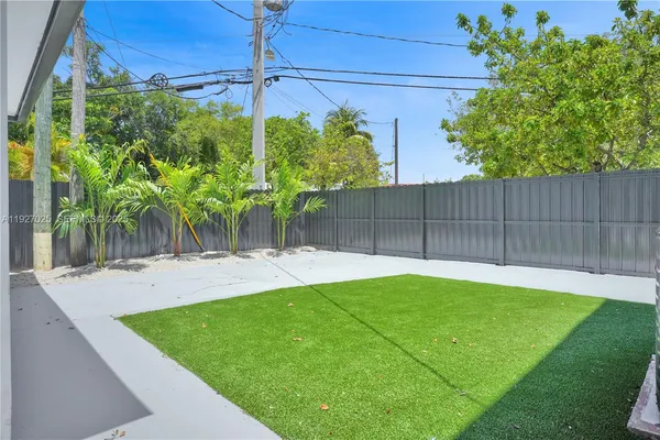 a view of a backyard with plants