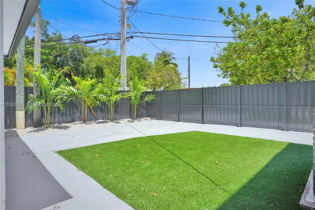 a view of a backyard with plants