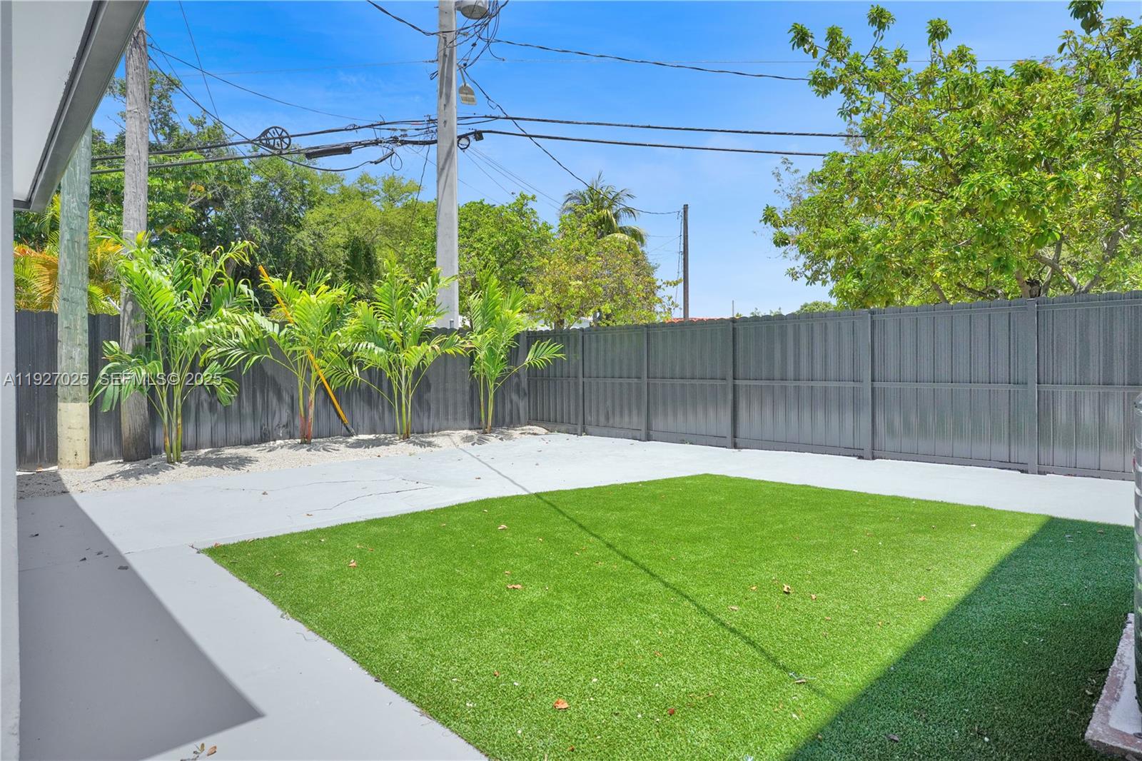 210 Beacom Boulevard, Unit B Miami, FL 33135 - Photo 9 of 9 a view of a backyard with plants
