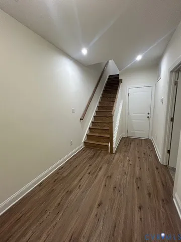 a view of entryway with wooden floor