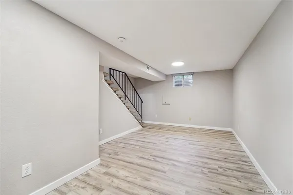 a view of an empty room with stairs