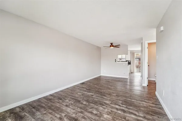 a view of a bedroom with a hardwood floor