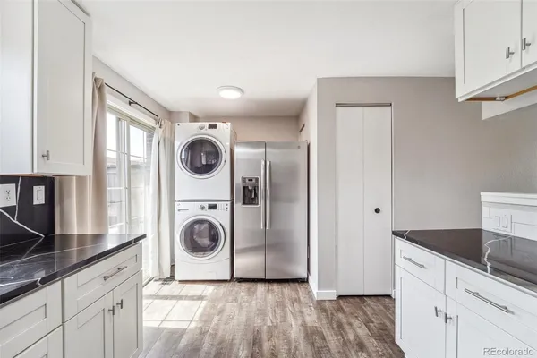 a utility room with sink dryer and washer