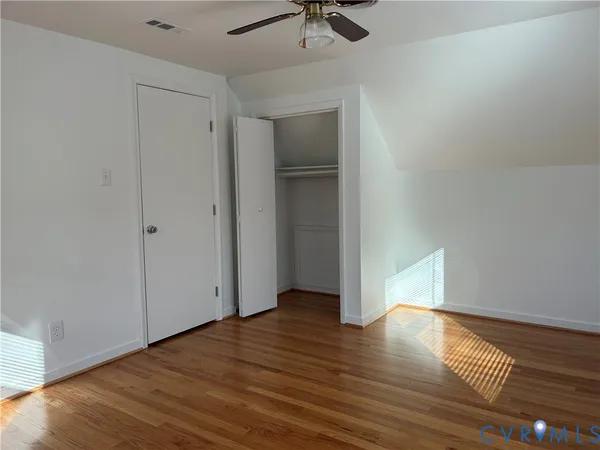 a view of livingroom with hardwood floor and a ceiling fan