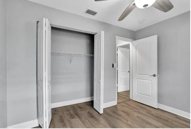 a view of an empty room with a bathroom