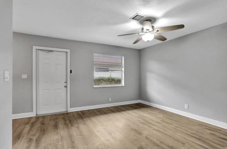 240 Southeast 9th Avenue, Unit 2 Pompano Beach, FL 33060 - Photo 7 of 17 wooden floor in an empty room with a window
