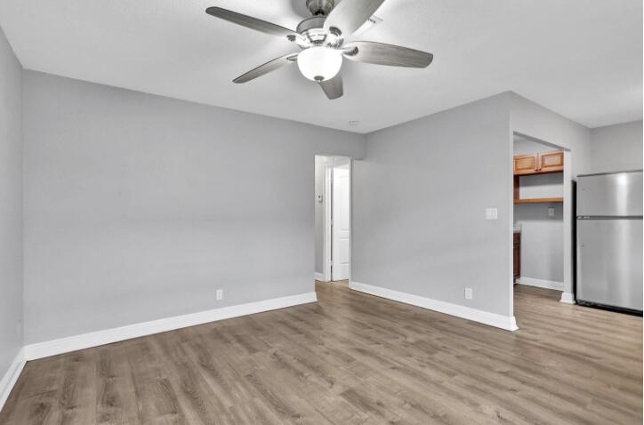 240 Southeast 9th Avenue, Unit 2 Pompano Beach, FL 33060 - Photo 9 of 17 wooden floor in an empty room with a window