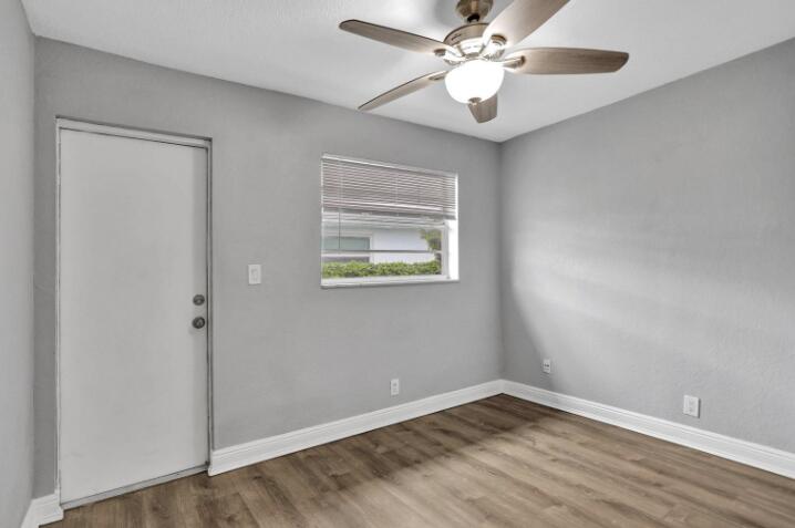 240 Southeast 9th Avenue, Unit 2 Pompano Beach, FL 33060 - Photo 10 of 17 wooden floor in an empty room with a window