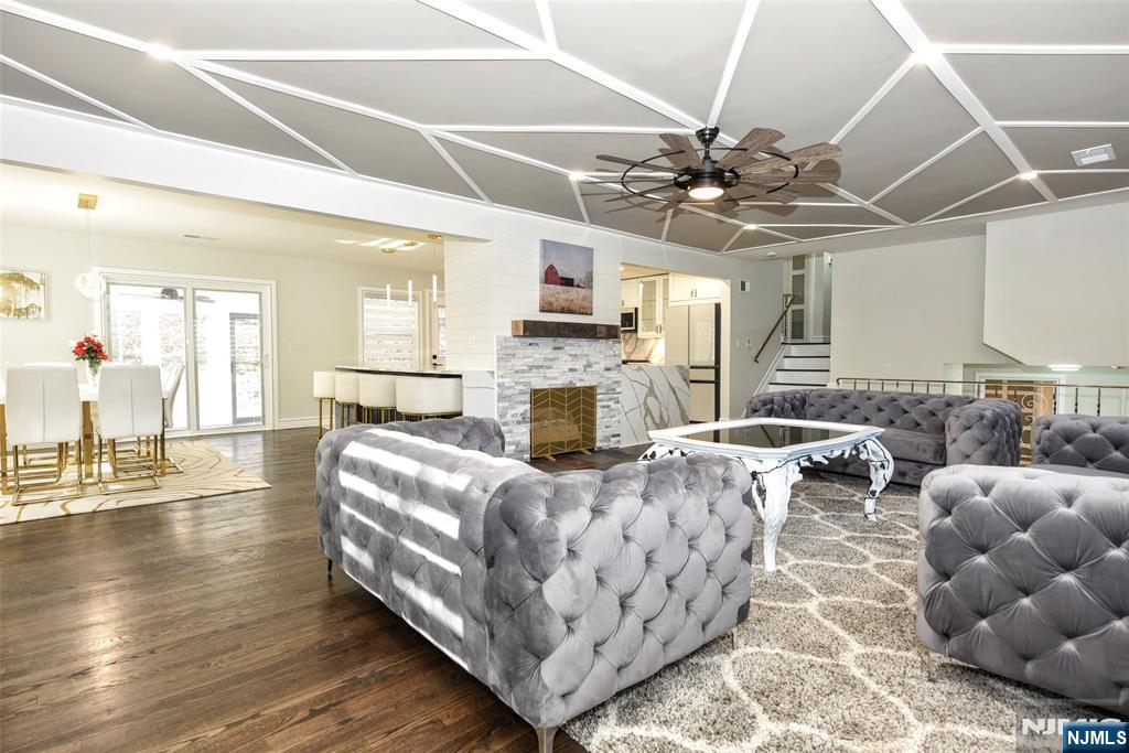 28 Overlook Road Saddle River, NJ 07458 - Photo 11 of 35 a living room with fireplace furniture and a chandelier