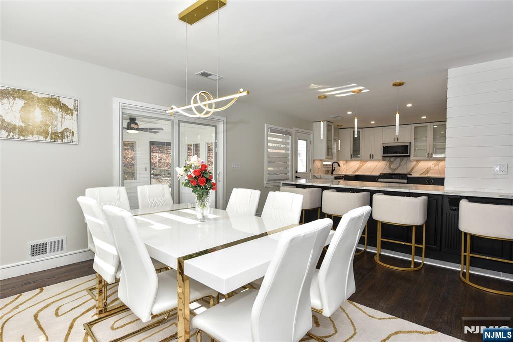 28 Overlook Road Saddle River, NJ 07458 - Photo 13 of 35 a view of a dining room with furniture and wooden floor