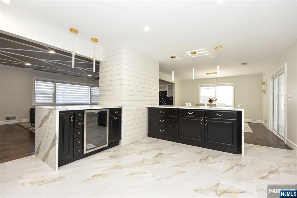 28 Overlook Road Saddle River, NJ 07458 - Photo 17 of 35 a kitchen with stainless steel appliances kitchen island granite countertop a stove and a sink