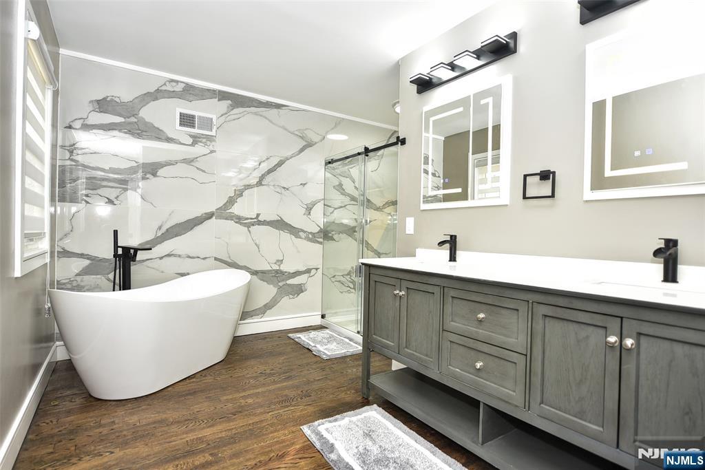 28 Overlook Road Saddle River, NJ 07458 - Photo 24 of 35 a living room with a couch and dresser with wooden floor