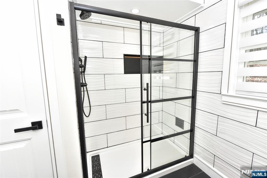 28 Overlook Road Saddle River, NJ 07458 - Photo 29 of 35 a bathroom with a glass shower door