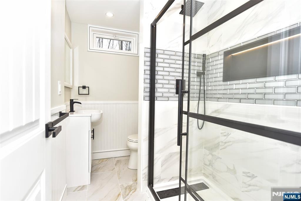 28 Overlook Road Saddle River, NJ 07458 - Photo 32 of 35 a bathroom with a sink a toilet and shower
