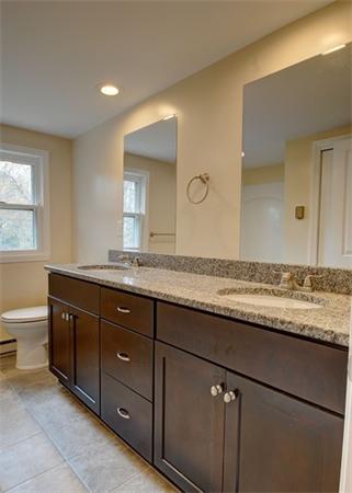 19 Zuell Hill Road Monson, MA 01057 - Photo 21 of 27 a bathroom with a granite countertop double vanity sink and a mirror