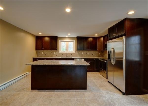 19 Zuell Hill Road Monson, MA 01057 - Photo 5 of 27 a kitchen with stainless steel appliances granite countertop a refrigerator a stove a sink and a microwave