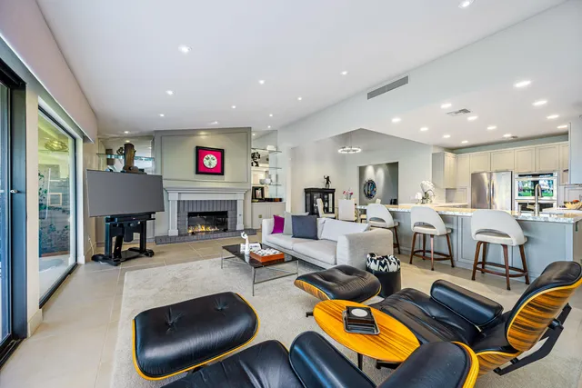 a view of a house with swimming pool yard and outdoor seating
