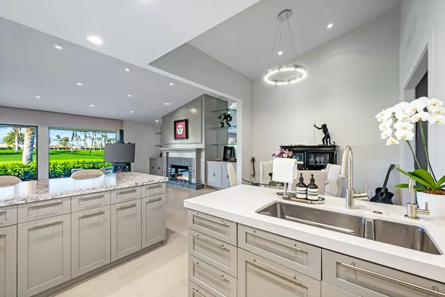 a bedroom with a bed closet and large window