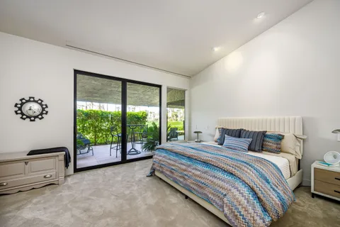 a utility room with cabinets washer and dryer