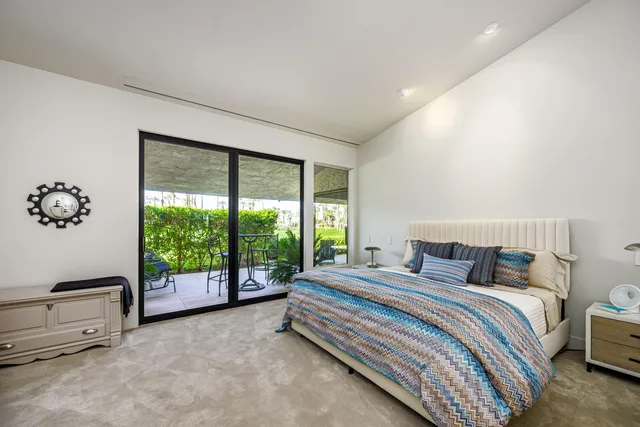 a utility room with cabinets washer and dryer