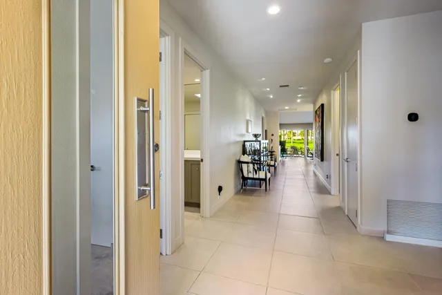a kitchen with a sink and living room