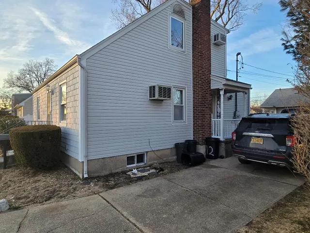 a view of a car in front of a house