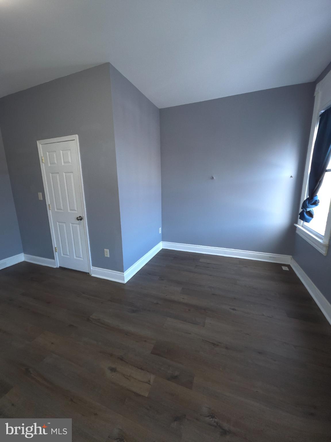 2617 East Preston Street Baltimore, MD 21213 - Photo 16 of 30 a view of an empty room with wooden floor