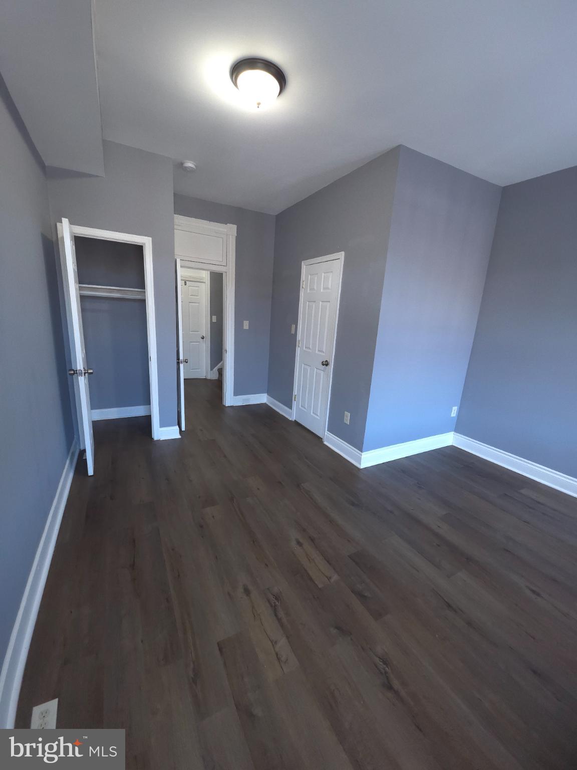 2617 East Preston Street Baltimore, MD 21213 - Photo 17 of 30 an empty room with wooden floor and closet