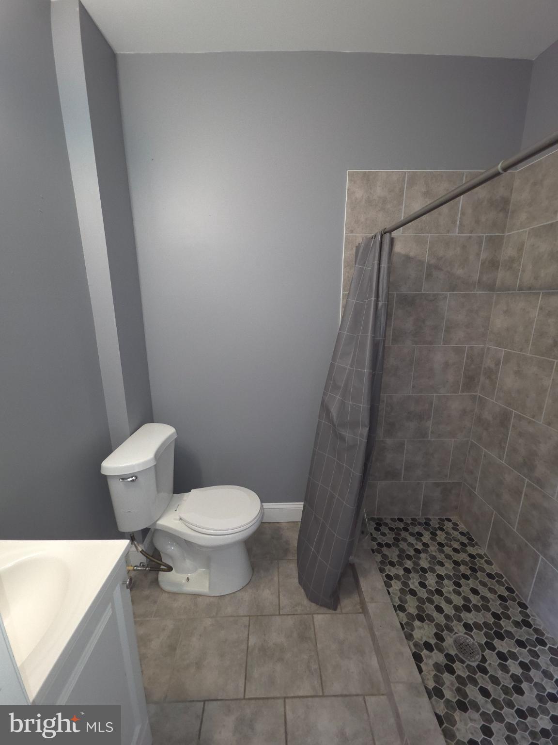 2617 East Preston Street Baltimore, MD 21213 - Photo 30 of 30 a bathroom with a toilet and a shower