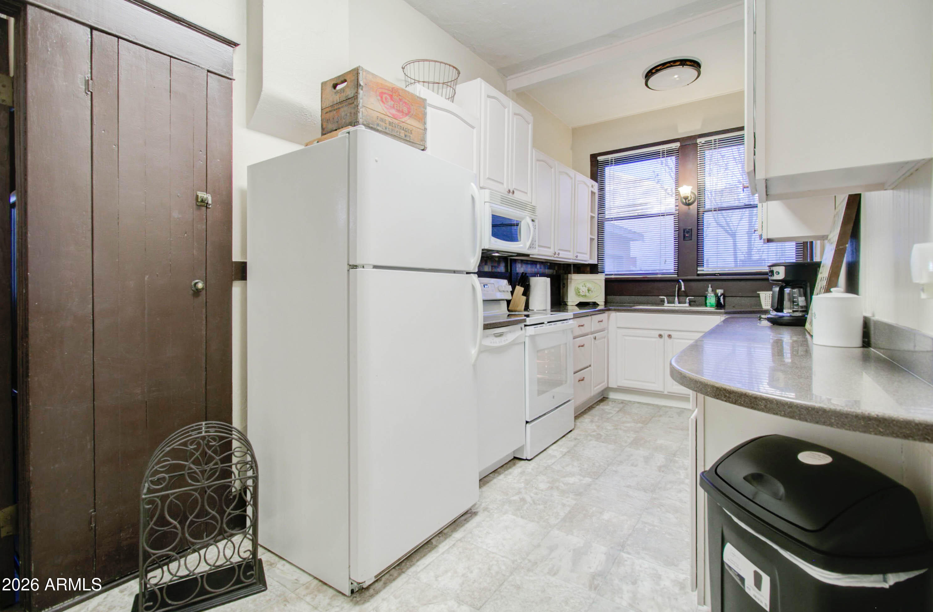 385 South Broad Street Globe, AZ 85501 - Photo 13 of 36 a kitchen with stainless steel appliances a refrigerator sink and cabinets