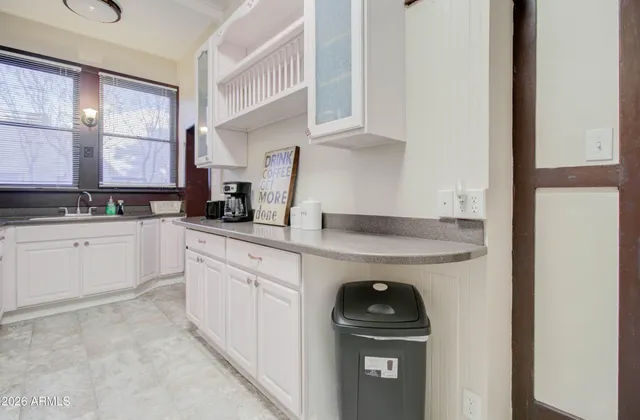 a kitchen with appliances cabinets and a sink