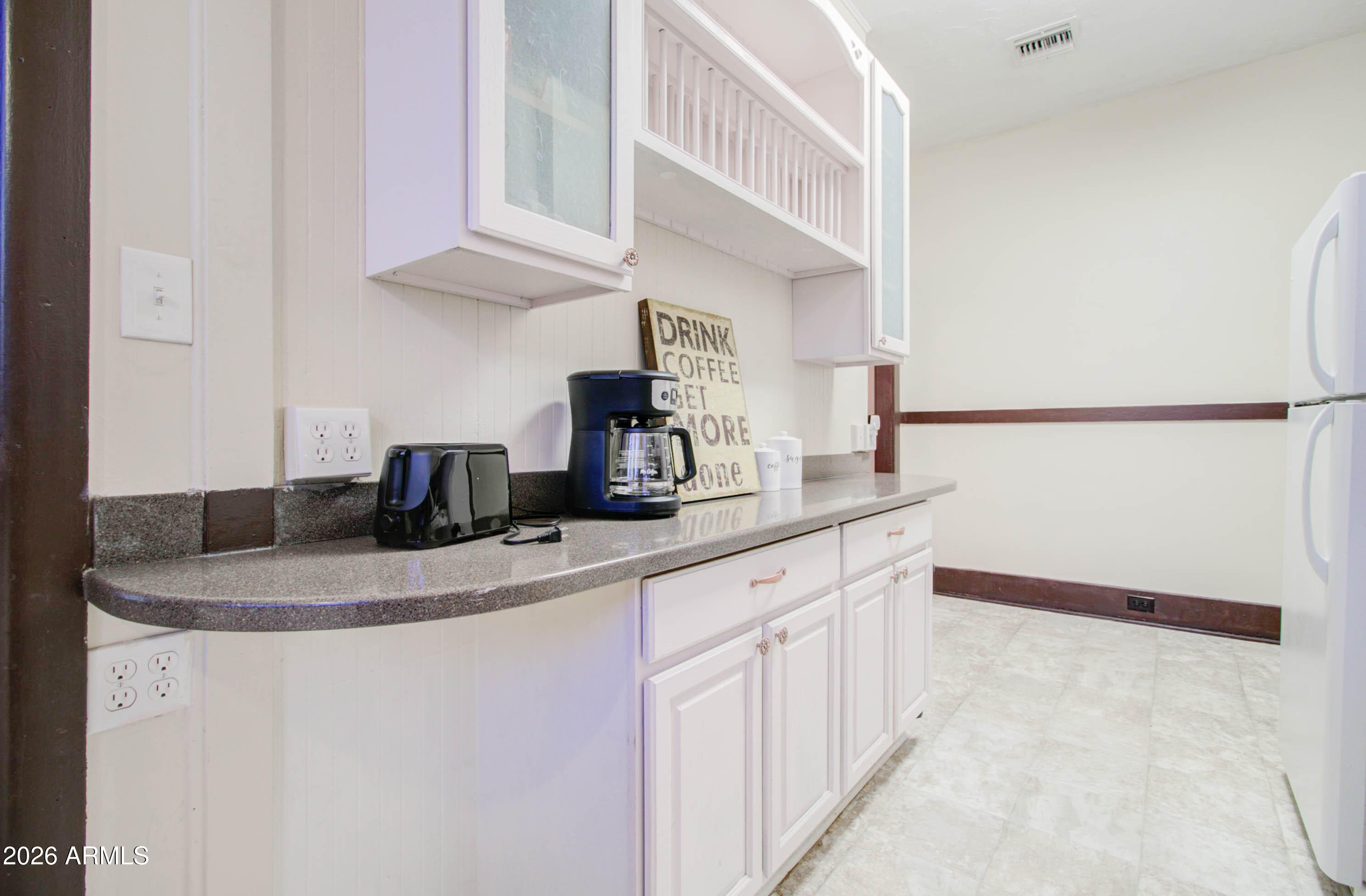 385 South Broad Street Globe, AZ 85501 - Photo 17 of 36 a kitchen with stainless steel appliances granite countertop a sink and a refrigerator