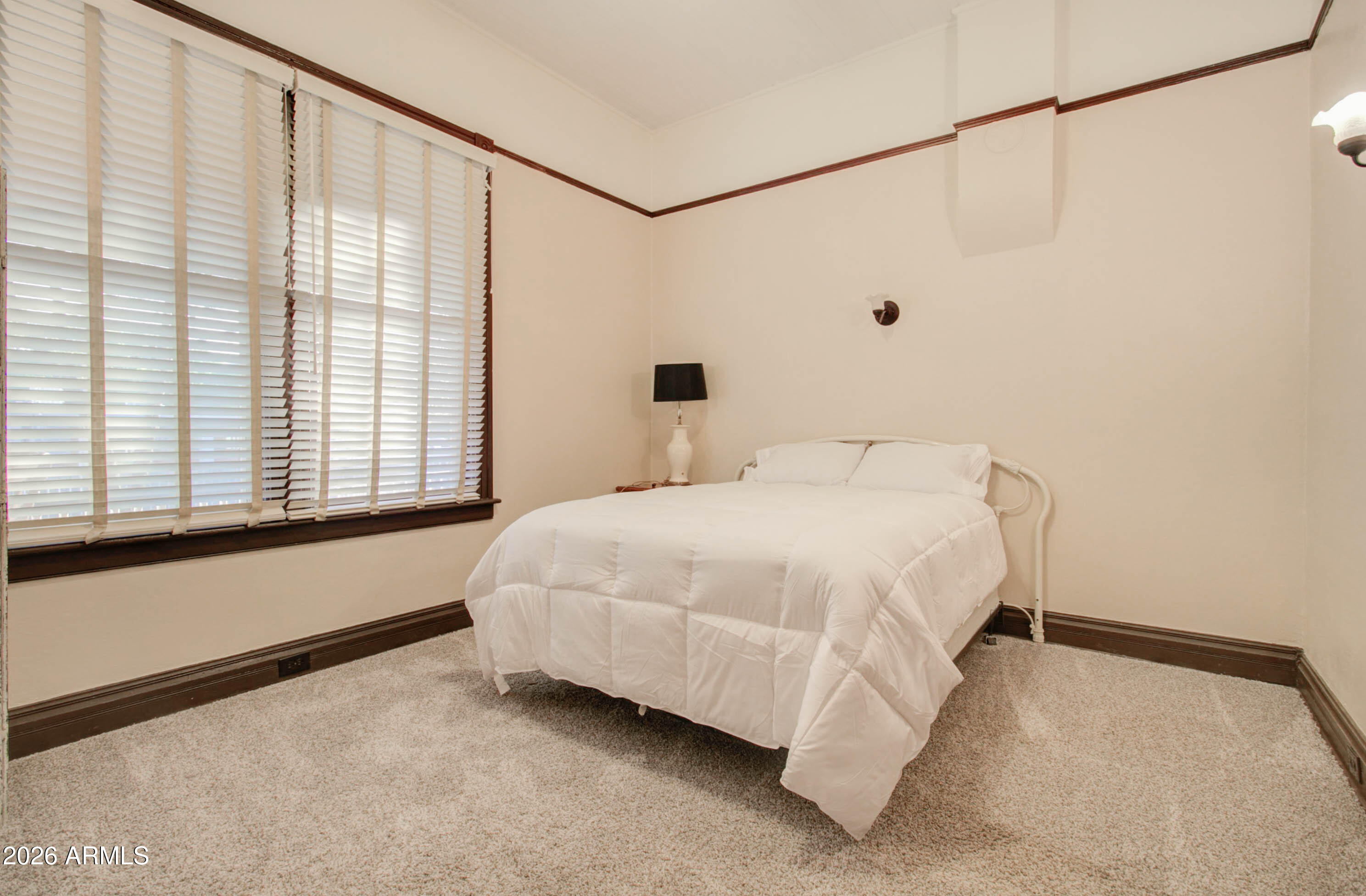 385 South Broad Street Globe, AZ 85501 - Photo 18 of 36 a bed room with a bed and a large window