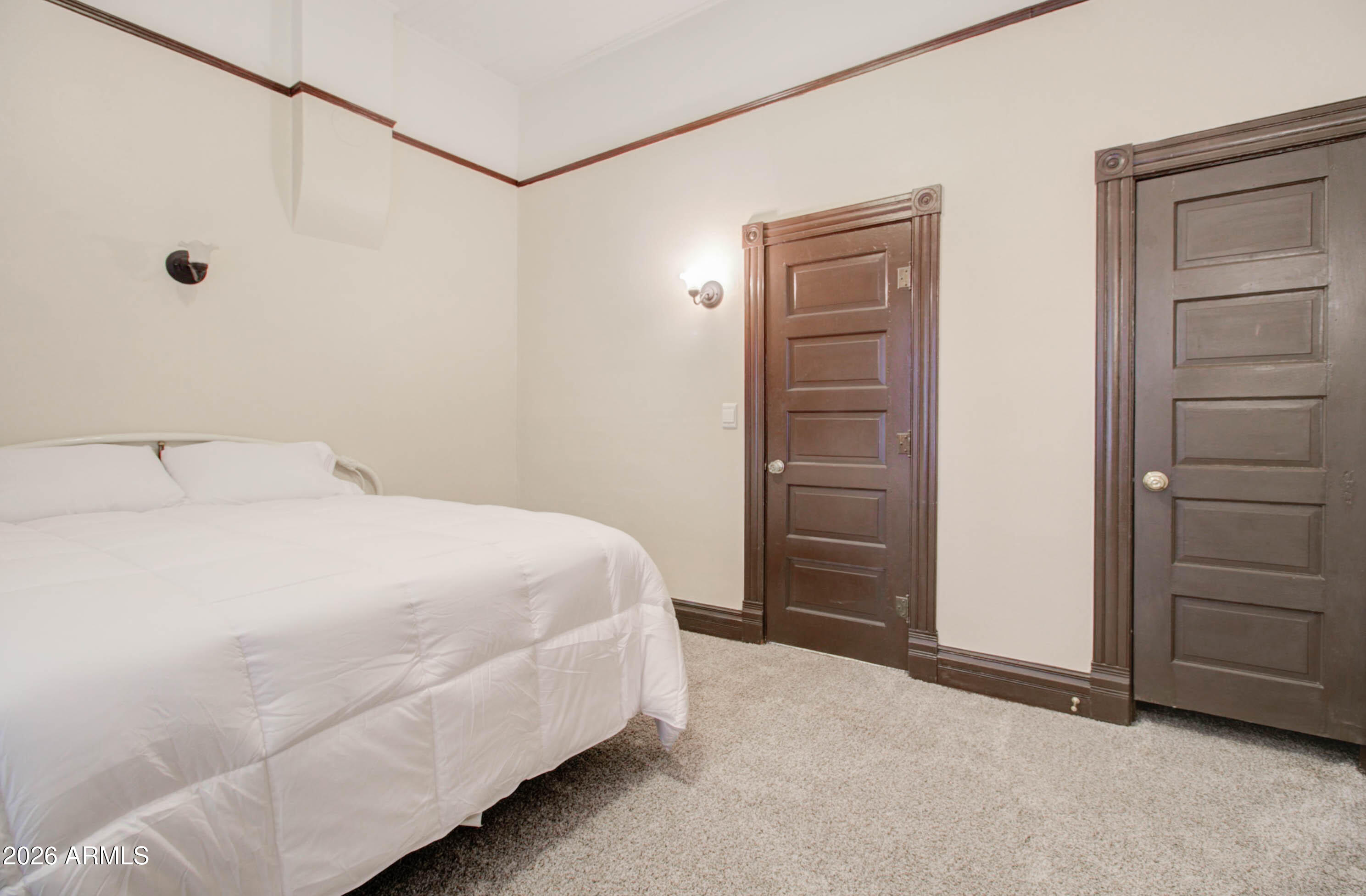 385 South Broad Street Globe, AZ 85501 - Photo 19 of 36 a bedroom with a bed and a walk in closet