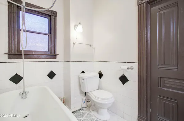 a bathroom with a bathtub and shower