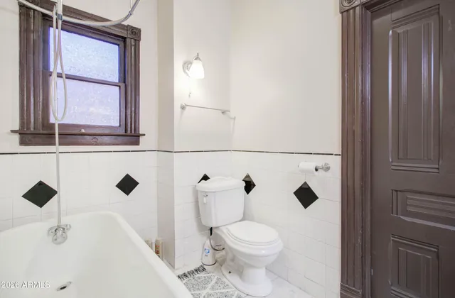 a bathroom with a bathtub and shower