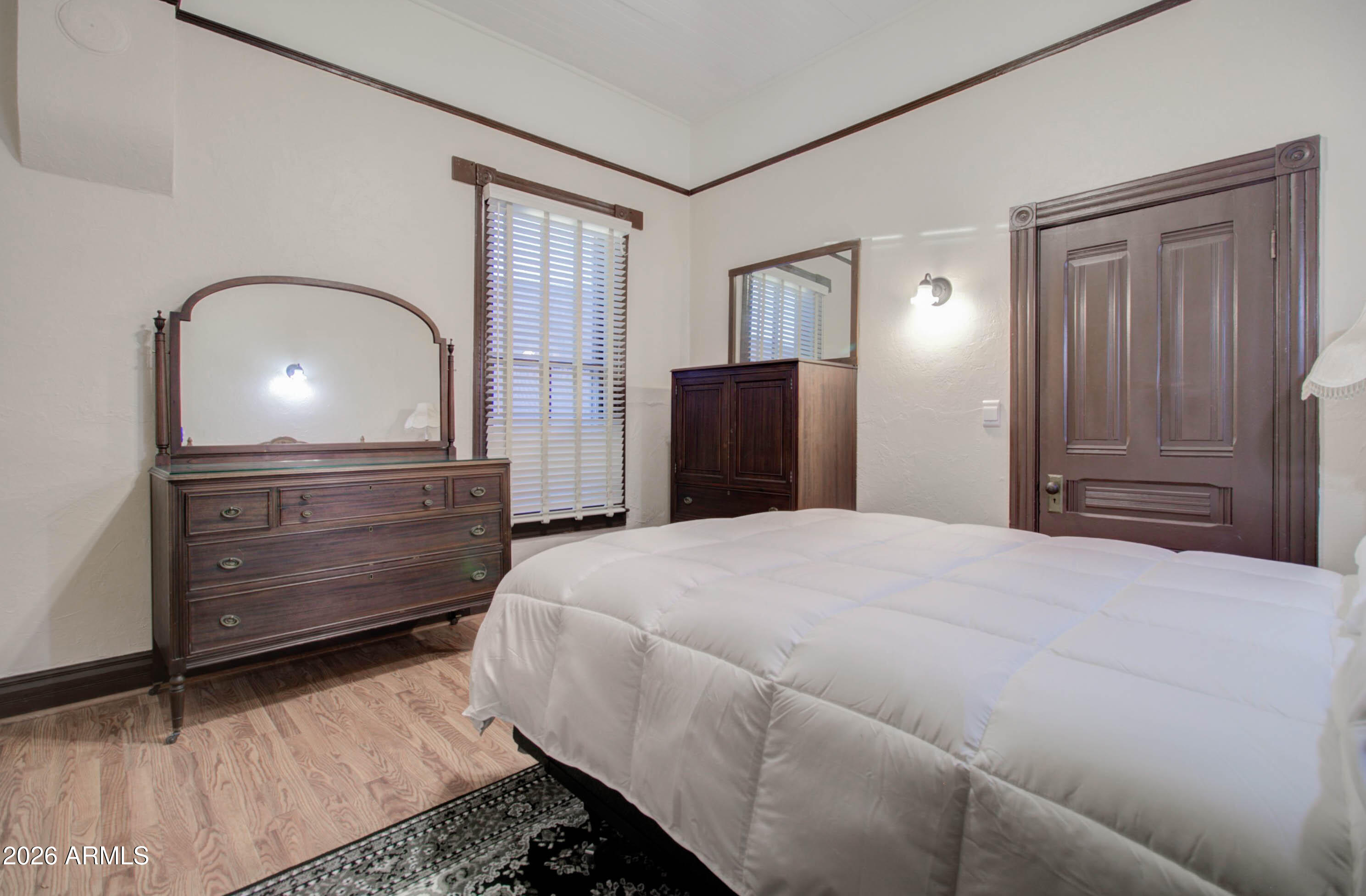 385 South Broad Street Globe, AZ 85501 - Photo 22 of 36 a bedroom with a bed and a dresser