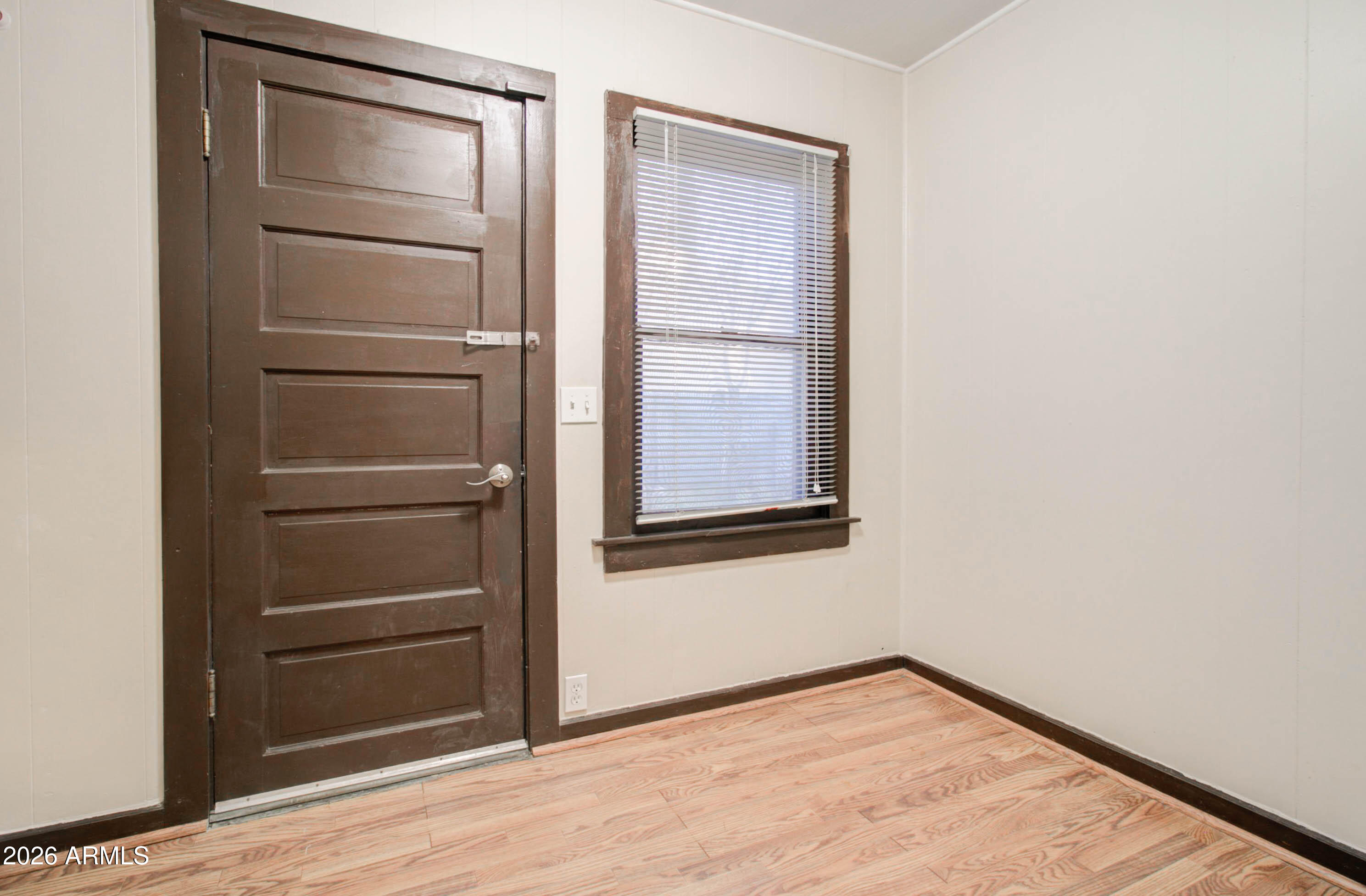 385 South Broad Street Globe, AZ 85501 - Photo 27 of 36 a view of a room with an empty space and wooden floor