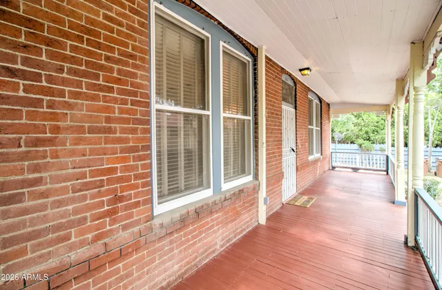 a view of a brick house with a large window