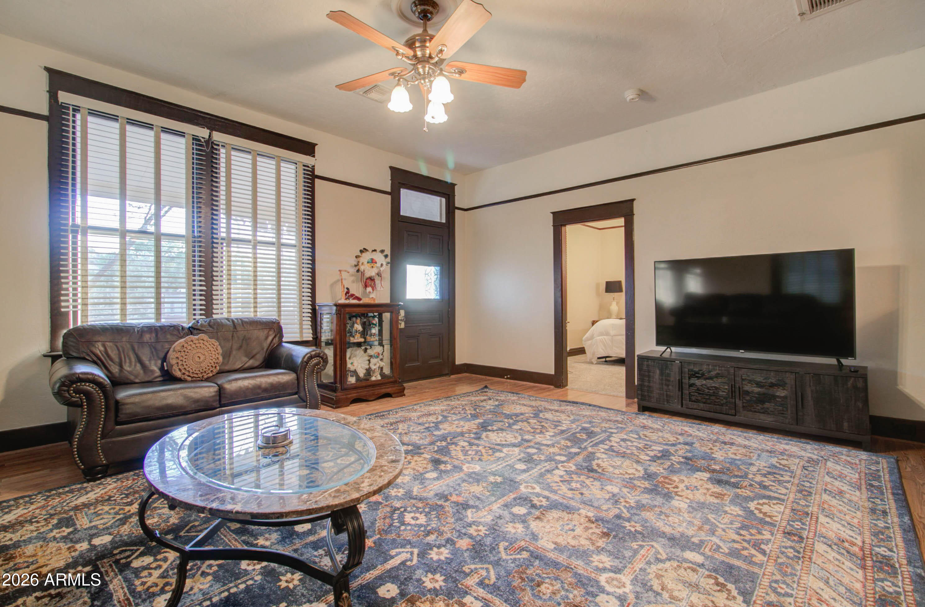 385 South Broad Street Globe, AZ 85501 - Photo 9 of 36 a living room with furniture and a flat screen tv