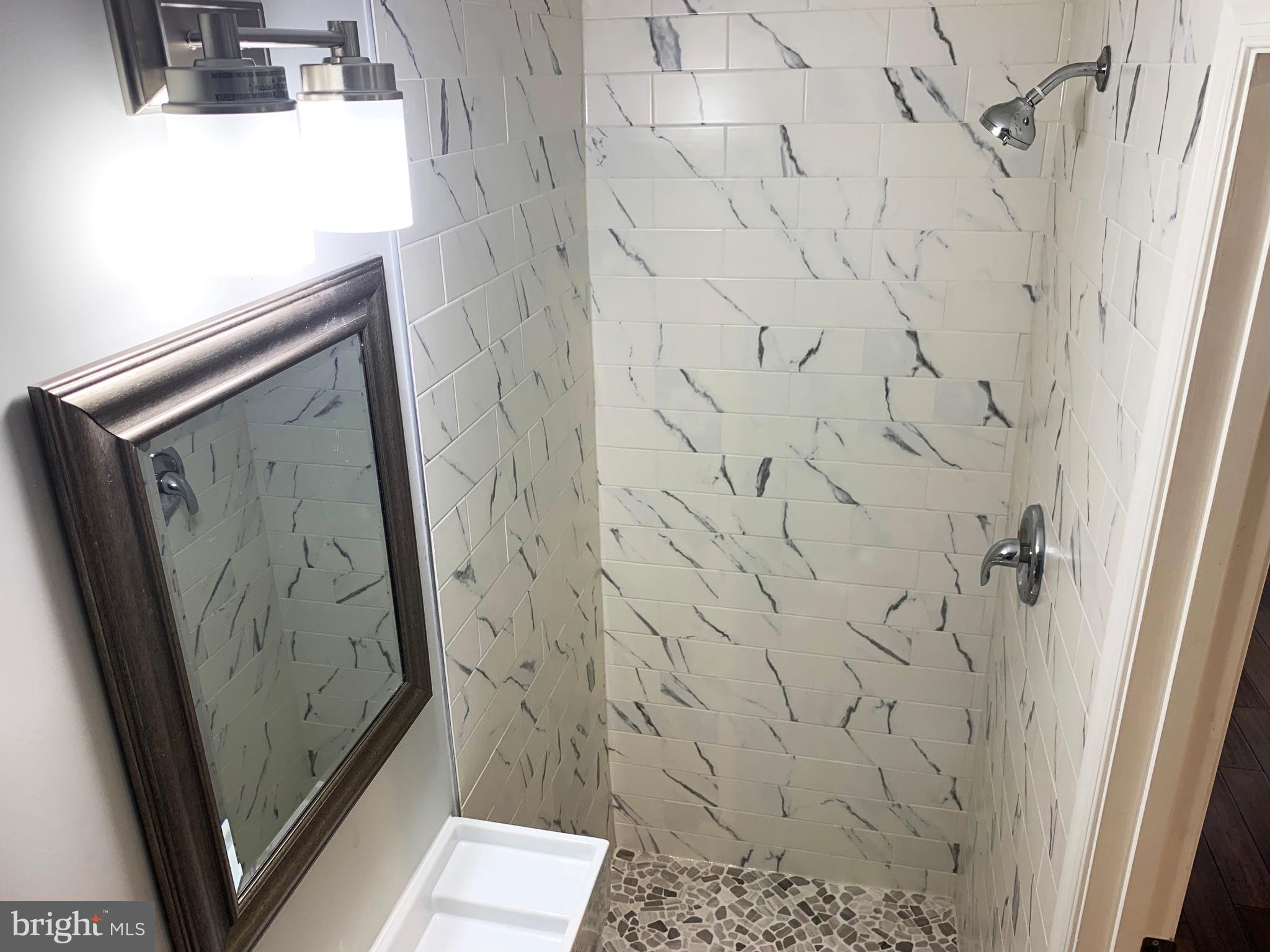 12707 Gould Road Silver Spring, MD 20906 - Photo 15 of 23 a bathroom with a shower