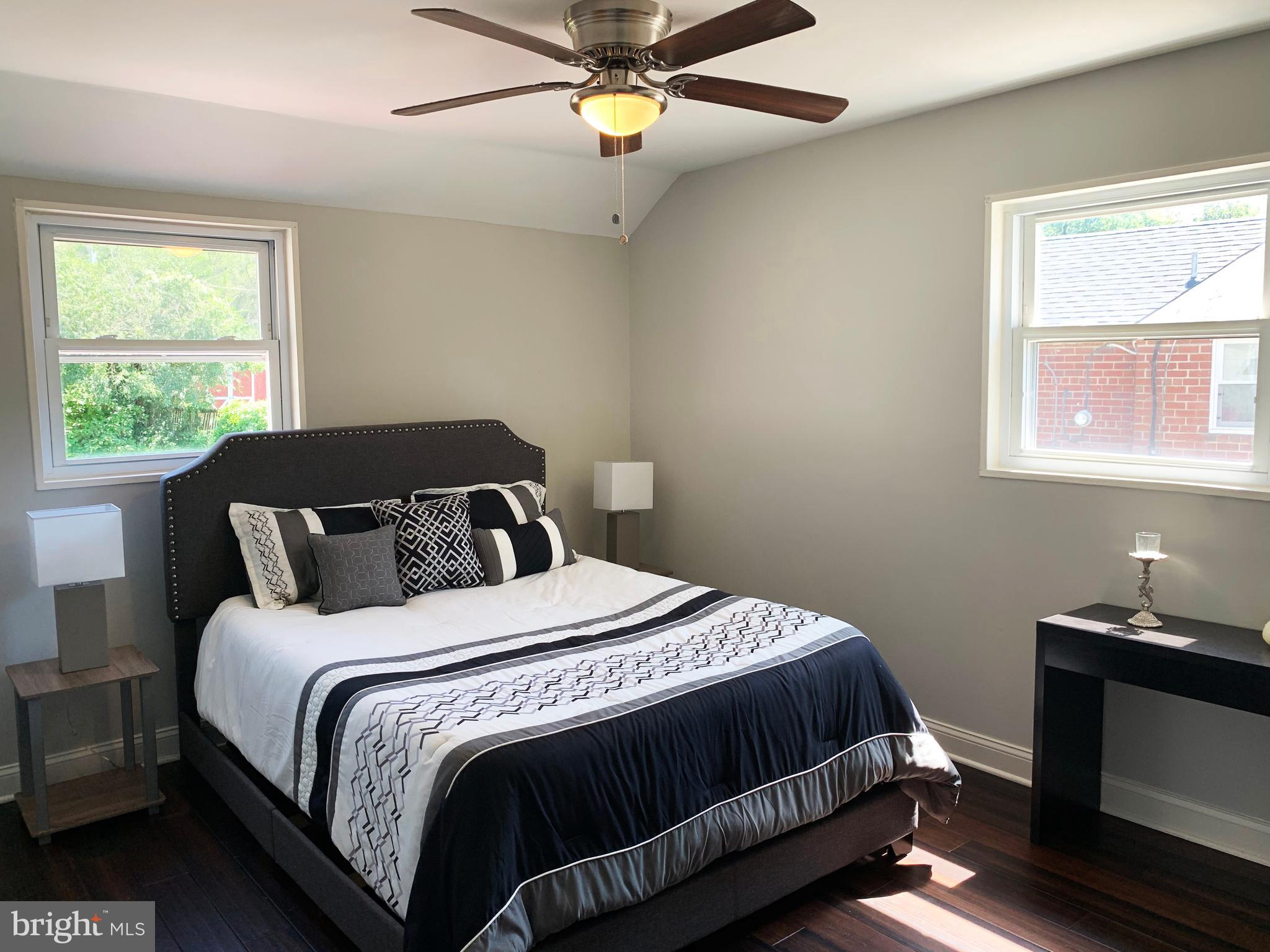12707 Gould Road Silver Spring, MD 20906 - Photo 17 of 23 a bedroom with a bed and window